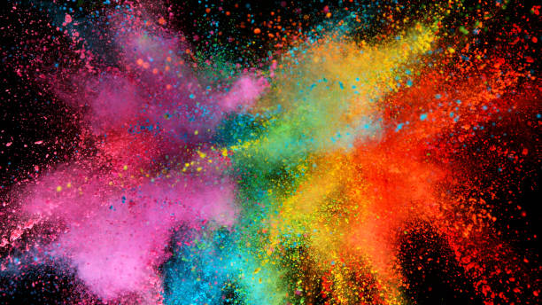 istock Explosion of colored powder isolated on black background 1198260446