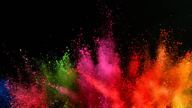 istock Explosion of colored powder isolated on black background 1198260510
