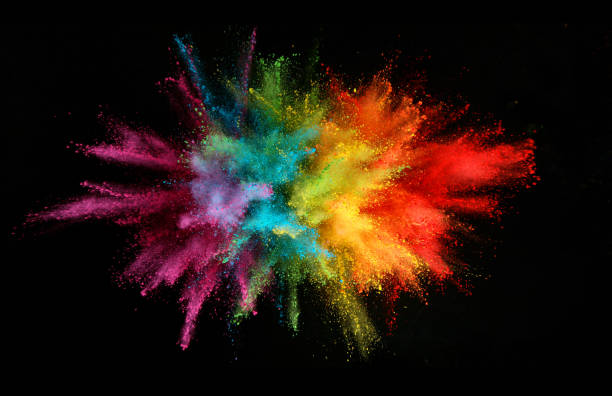 istock Explosion of colored powder isolated on black background 1198260541