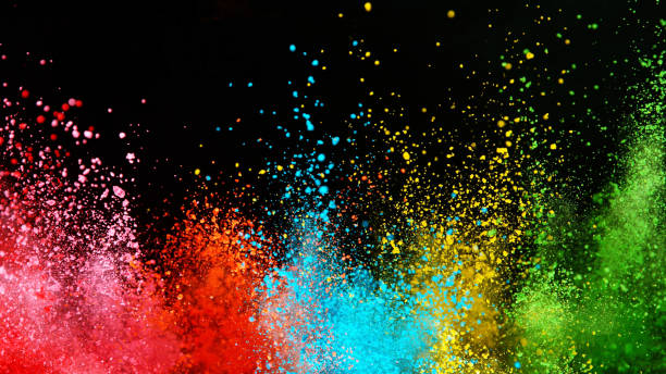 istock Explosion of colored powder isolated on black background 1198260555