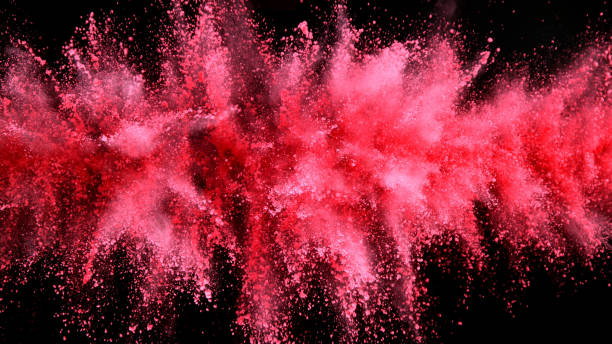 istock Explosion of pink powder isolated on black background 1198260747