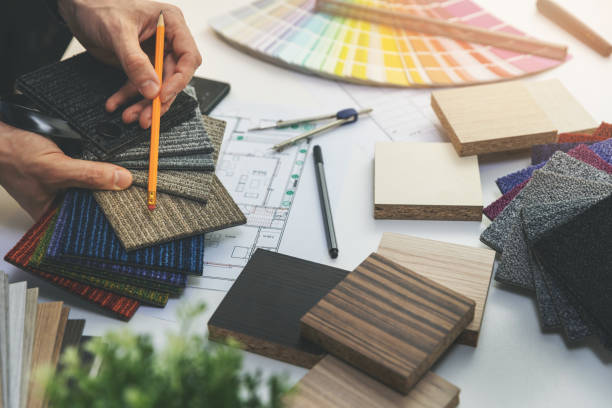 istock designer choosing flooring and furniture materials from samples for home interior design project 1198261867