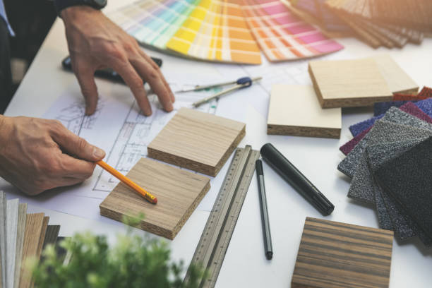 istock designer choosing flooring and furniture materials from samples for home interior design project 1198261868