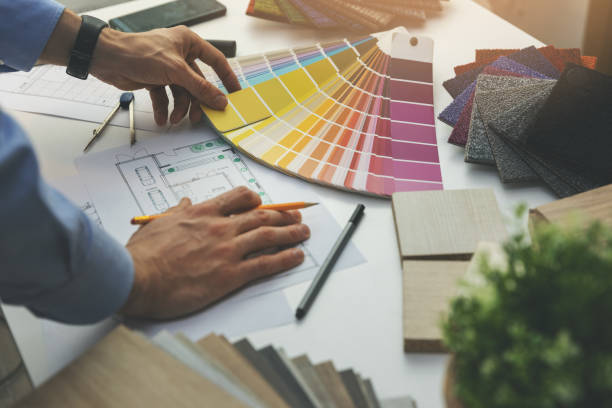 istock designer choosing paint color from swatch for home interior design project 1198261869
