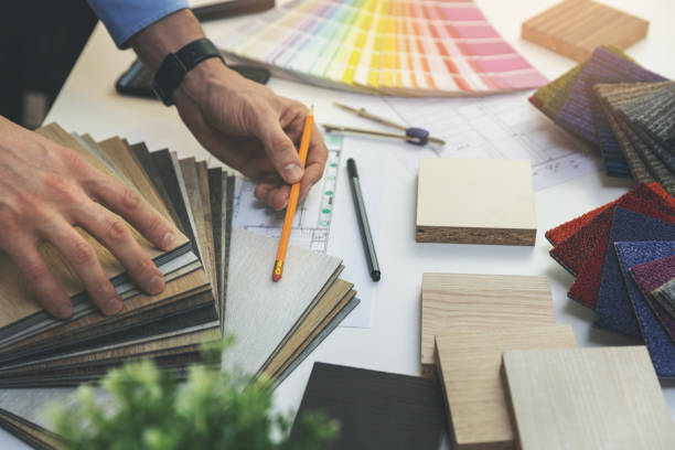 istock designer choosing flooring and furniture materials from samples for home interior design project 1198261878