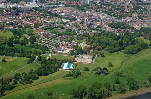 Aerial view of the historic Syon House and Park in Brentford, West London on a sunny summer day.