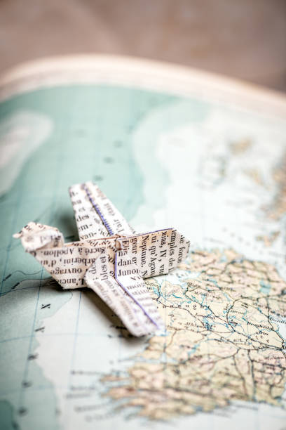 istock Origami travel concepts: Airplane flying on map (Ireland) 1198262982