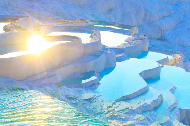 thermal springs located on white limestone terraces, natural baths pamukkale, denizli province, turkey - mineral waterfall water flowing imagens e fotografias de stock