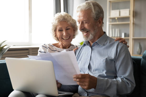 istock Elderly couple using online banking website check savings feels satisfied 1198265928