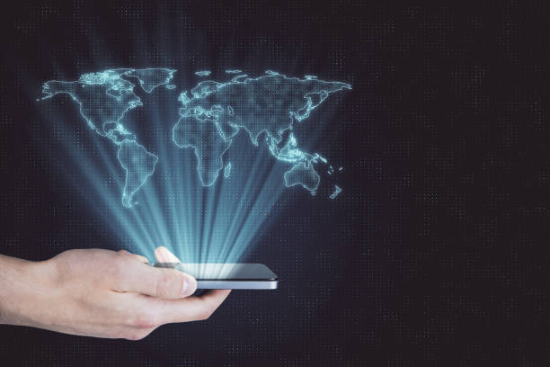 istock Digital globalization concept with digital world map layout above human hand with smartphone. 1198267762