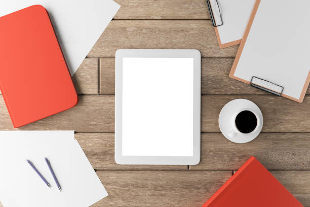 istock Wooden office desk with white tablet 1198267976