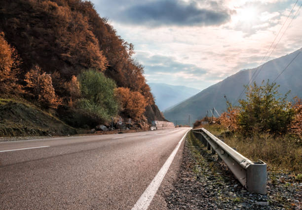 istock mountain road and sky with sunbeams in Georgia 1198268155