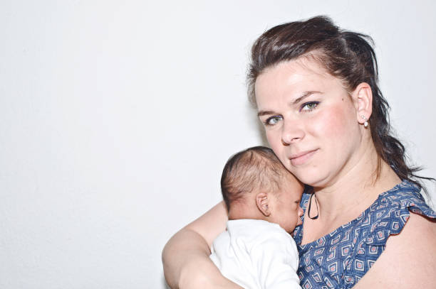 Mother cuddling a new-born child