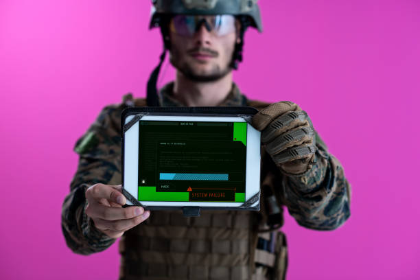 istock soldier showing a tablet with system faliure screen 1198274117