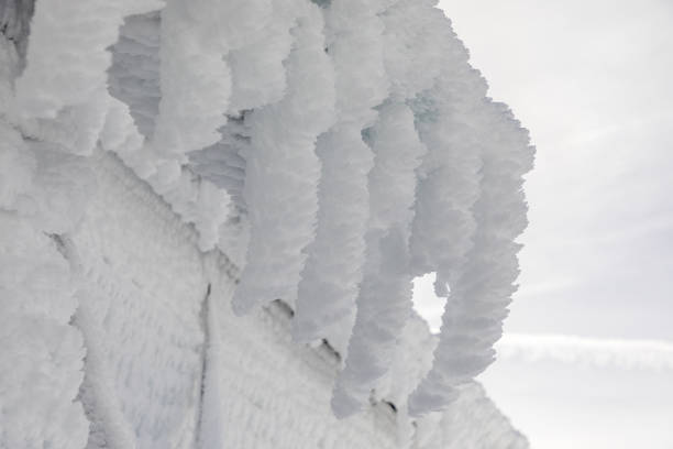 ice icicles on the eave of a roof