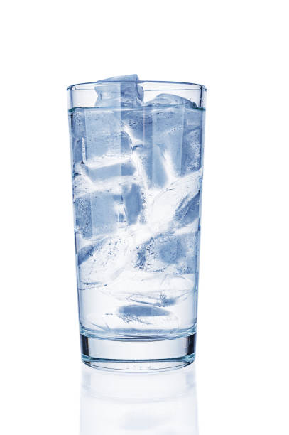 istock Glass with pure water and ice on white background 1198274987