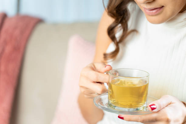 istock Woman drinking herb tea 1198275377