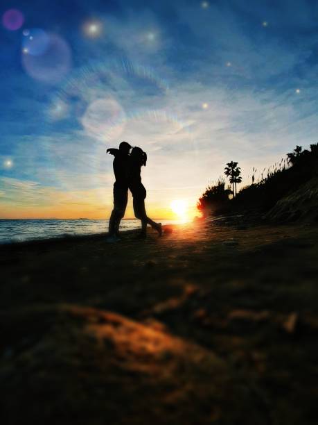 Love at sunset at beach stock photo