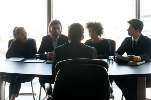 istock Male job applicant talk at interview in office 1198278238