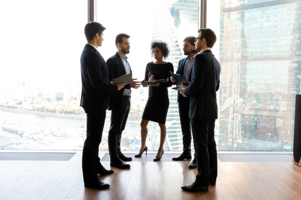 istock Multiracial businesspeople talk consider ideas in office together 1198278244
