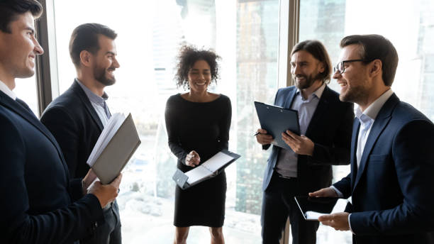 istock Happy diverse colleagues have fun brainstorming in office 1198278248