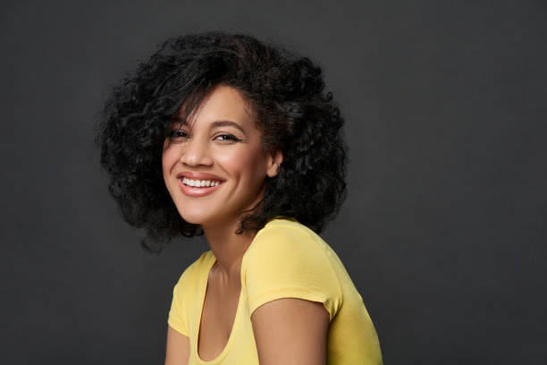 istock Happy woman looking at camera smiling 1198279451
