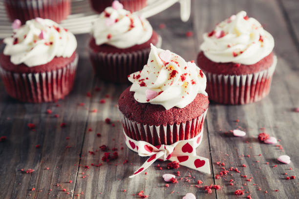 istock Red velvet cupcakes on a rustic wooden table for Valentines day 1198280353