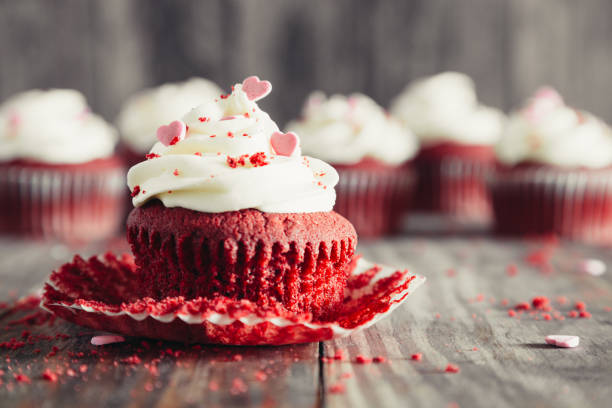 istock Red velvet cupcake opened on a rustic wooden table 1198280360