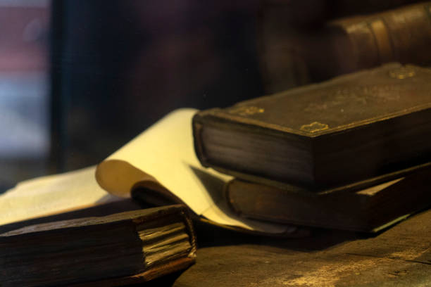 istock Old book and parchment detail 1198281173