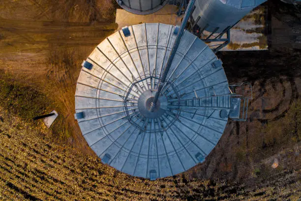 Aerial of Midwest Farm at Dusk with Silos