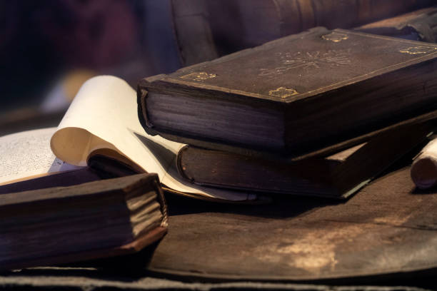 istock Old book and parchment detail 1198281207