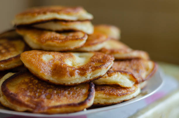 istock Freshly made fried fritters on a plate. 1198287061