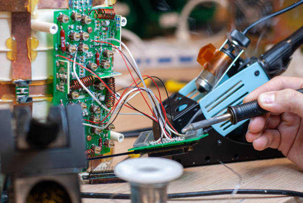 istock Tin soldering, on faulty electronic board 1198287163