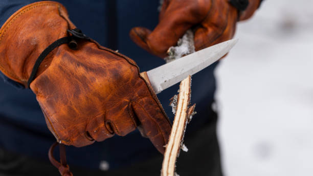 istock bushcraft knives and leather gloves 1198287190