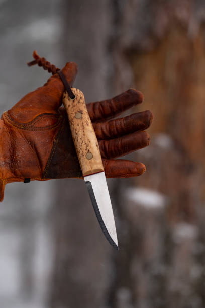 istock bushcraft knives and leather gloves 1198287205