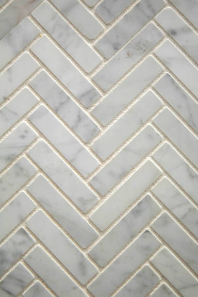 istock Seamless pattern herringbone Italian Carerra marble tile options for home improvement and renovations and new construction flooring and backsplash options 1198288400