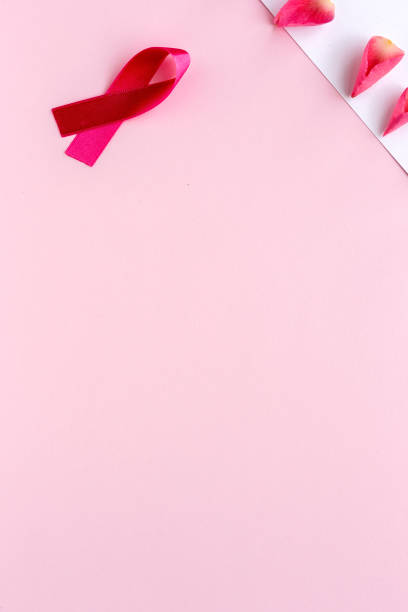 istock Pink ribbon on a colored background. Cancer 1198288402