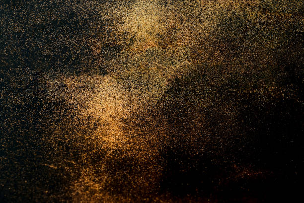 istock Black background with golden sparkles. Blurred  effect. Concept for festive background or for project 1198289674