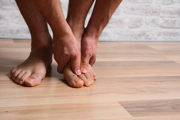 istock Pain, foot, man, muscular spasm 1198294331