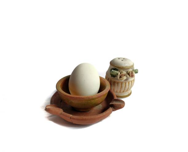 istock Boiled egg on a clay bowl with salt shaker. typical Guatemalan breakfast 1198296759