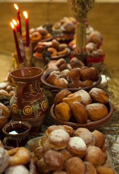 istock Donuts with icing sugar on a plate. Delicious fried donuts on a Christmas table at holy evening. 1198297047