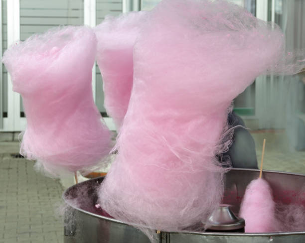 istock Pink cotton candies on the cotton candy machine. 1198297062