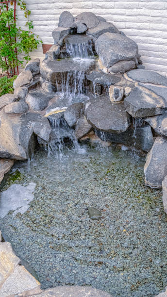 istock Vertical frame Cascade waterfall landscape decoration on a sunny day 1198297248