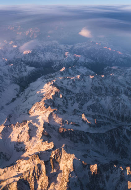 istock Clouds and sunset plane window view in Caucasus 1198299429
