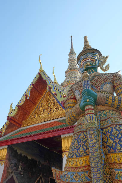 istock Patterned sculpture of a demonic warrior near a Buddhist temple. 1198299557