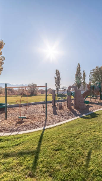 istock Vertical Kids playground with a covered picnic area 1198299847