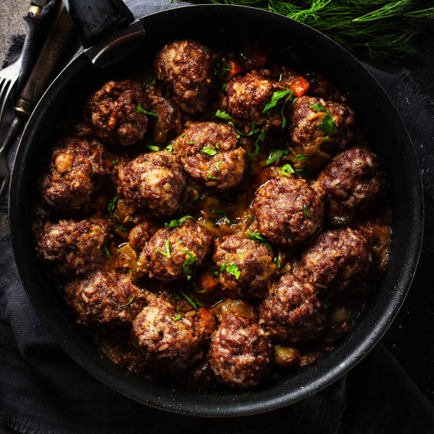 istock fried meatballs with tomato and vegetable 1198300851