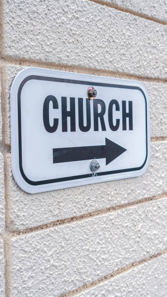 istock Vertical Church sign pointing to the right mounted on wall 1198301119
