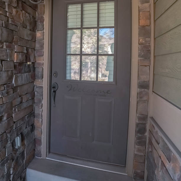 istock Square Entrance door to a house with feature brick wall 1198301830