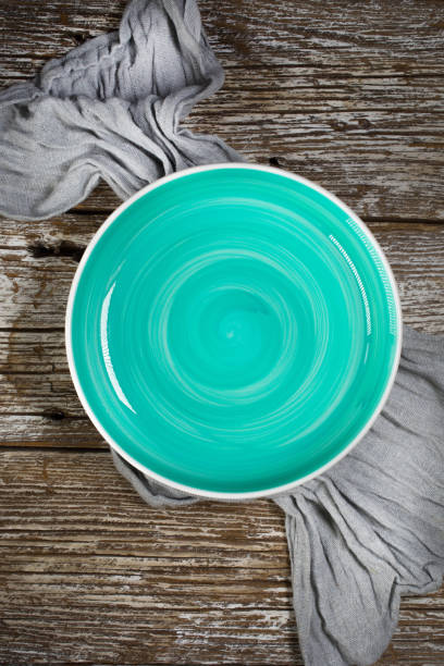 istock Empty plate on wooden countertop. 1198301957